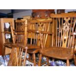 A set of eight country stick back dining chairs