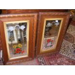 A pair of decorative oak framed wall mirrors