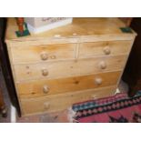 An antique pine chest of drawers