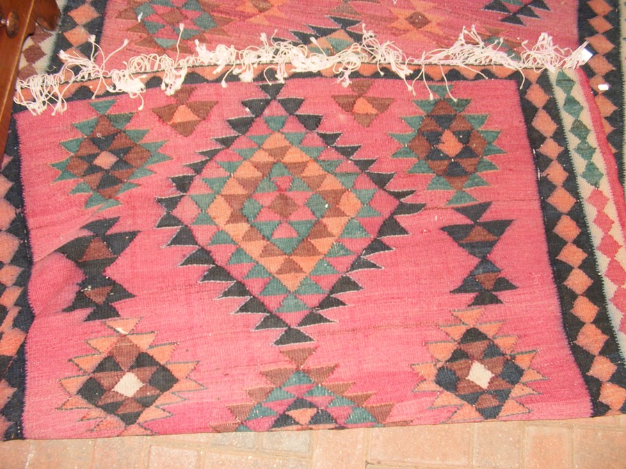 An antique rug with geometric centre medallion - 2 - Image 2 of 13