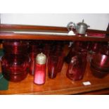 A selection of red glass ware