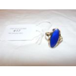 An oval lapis lazuli dress ring in 9 carat setting