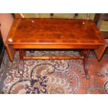 A reproduction yew wood sofa table