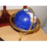 A gem set rotating World globe - 34cms high