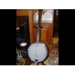 A Remo Weatherking banjo on stand
