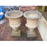 A pair of decorative garden urns