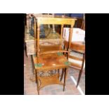 A pair of two tier walnut occasional tables