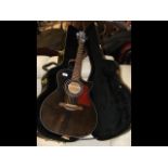 A 3/4 size Tanglewood six string electric/acoustic guitar