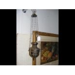 A white metal antique hanging incense burner