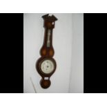 An inlaid wall barometer/thermometer