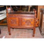 A carved Indian chest with sliding door - width 68