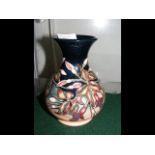 A Moorcroft Pottery vase with floral tube line dec