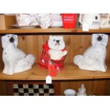 A pair of Staffordshire dog ornaments and one othe