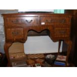 A writing desk with four drawers to the front