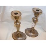A pair of 28.5 cm high silver fluted candlesticks