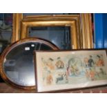 An oval wall mirror together with picture frames e