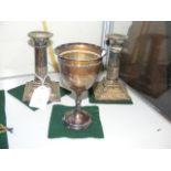 A pair of 13.5cm high silver candlesticks, togethe