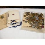 A selection of military badges, buttons etc