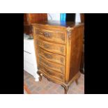 A French five drawer chest on carved cabriole supp
