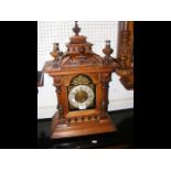An antique mantel clock with striking movement