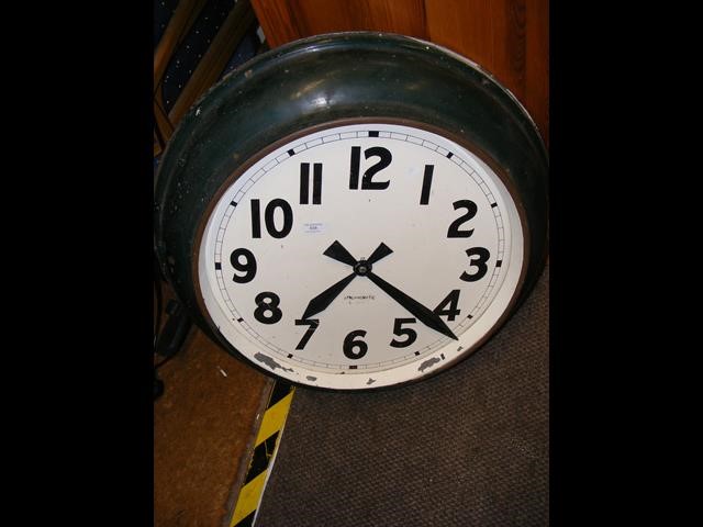 An old metal synchromatic electric station clock -
