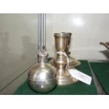 A pair of 10cm high silver candlesticks, together