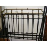 A Victorian wrought iron and brass bedstead