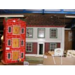 An old dolls house together with dolls furniture e