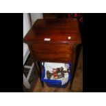 A mahogany work table together with linen and lace