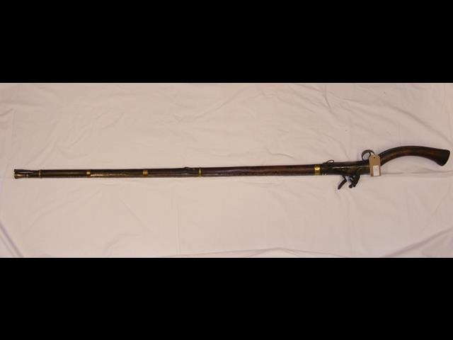 A rosewood Indian Sindhi flint lock rifle