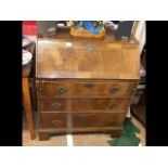 A reproduction walnut fall front bureau with fitte