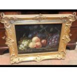 An oil on board still life of fruit in gilt frame