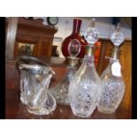 Two cut glass decanters and one cut glass ship's d