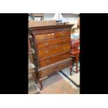 A Georgian mahogany chest on stand with dentil cor