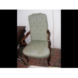 An armchair with cabriole front supports upholstere