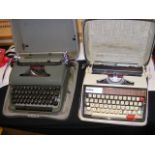 A vintage Olympia typewriter in case and one other