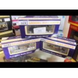 A boxed Dapol n gauge locomotive together with two