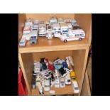 A quantity of die-cast vehicles - mostly ambulance