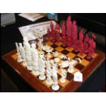 An old ivory chess set the king measuring 17cms hi