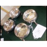 A set of four silver table salts