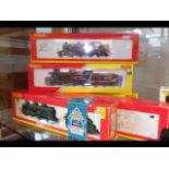 Three boxed Hornby 00 gauge locomotives and tender
