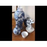 An Oriental blue and white vase and a Chinese porcelain month cup etc