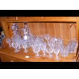 A quantity of cut glass decanters, tumblers and