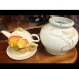 A Denby pottery vase together with a teapot on s