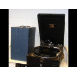 A 'His Master's Voice' portable gramophone with a