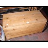 An old pine chest with unusual side hinge