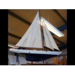 A model sailing yacht labelled 'Shamrock'