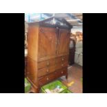 Early 19th century mahogany linen press with pierc