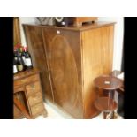 A 19th century storage cupboard with slides to the