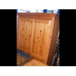 Pine wardrobe with panelled doors